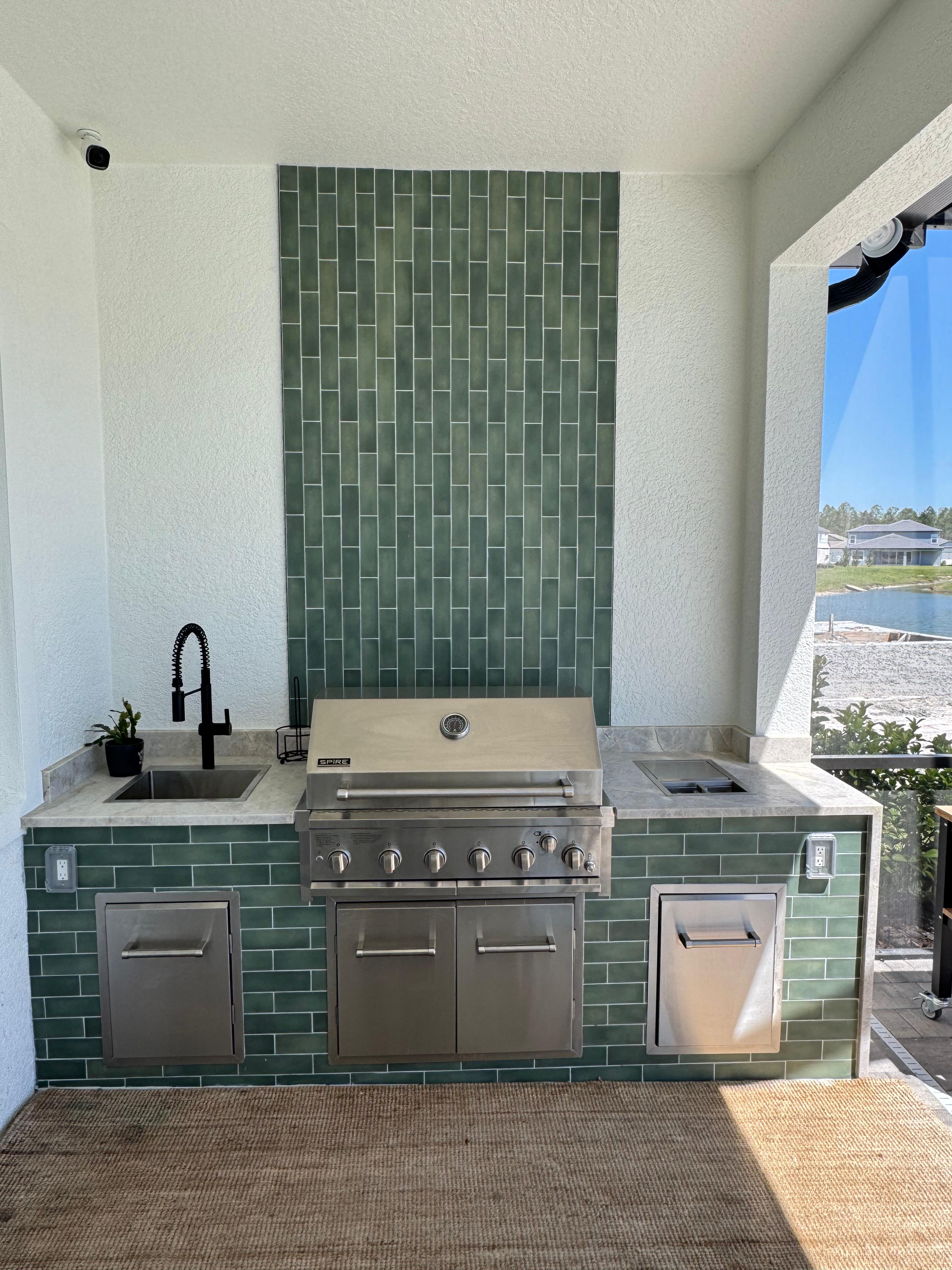 Outdoor kitchen with green cladding